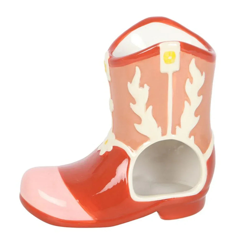Orange cowboy boot oil warmer with open warming chamber and white cutout design