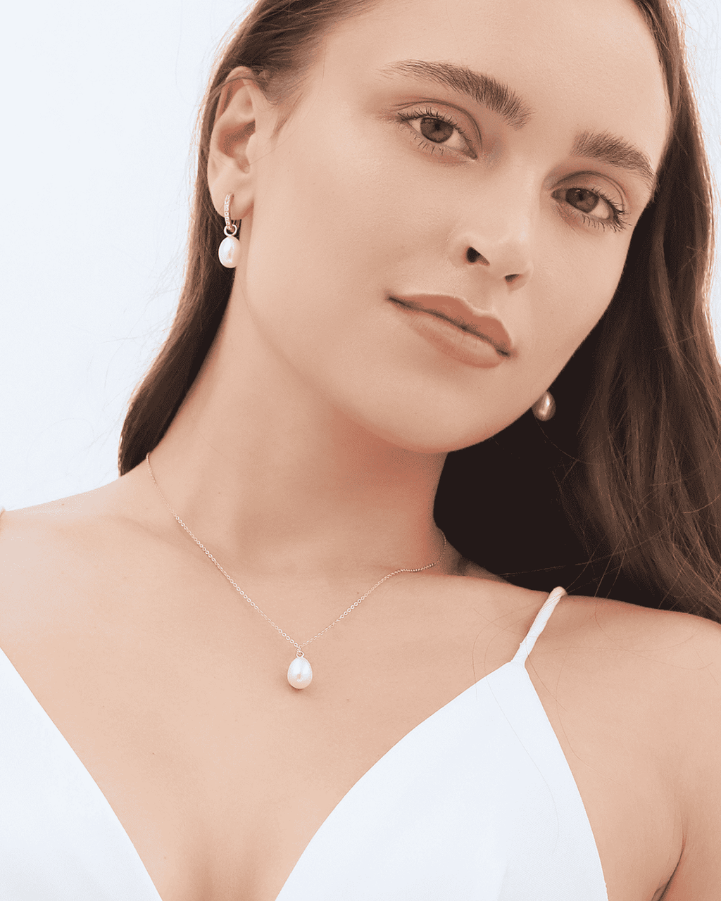 Gold vermeil teardrop freshwater pearl necklace worn close-up on model