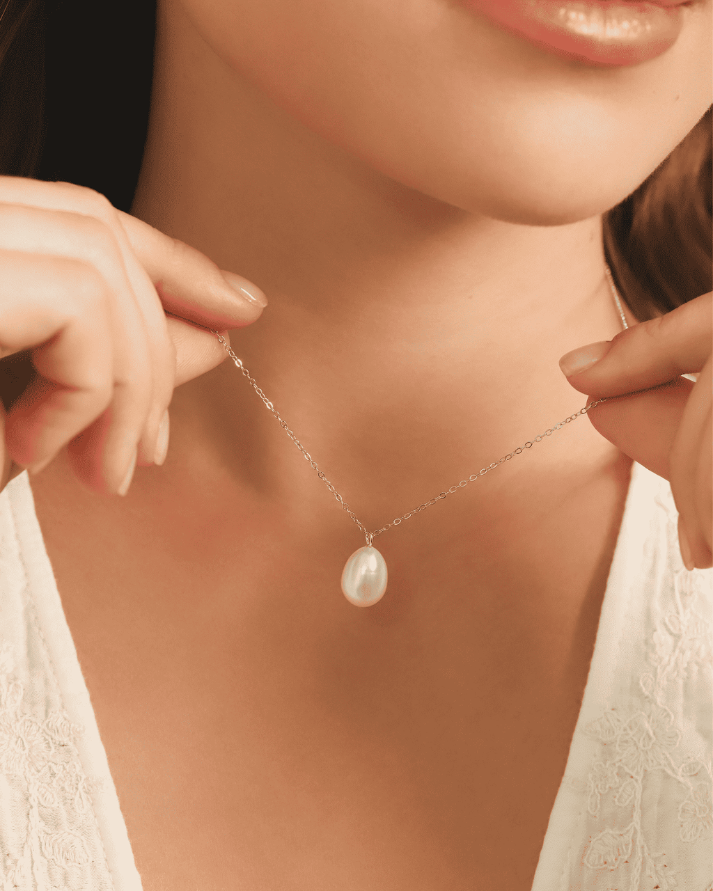 Close-up of sterling silver freshwater pearl pendant necklace with teardrop pearl