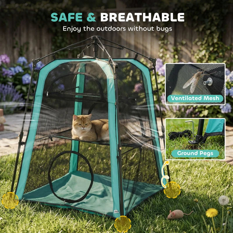 Teal and black breathable mesh cat tent with ground pegs and outdoor setup