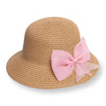 Tan straw bucket hat with large pink bow ribbon trim, wide brim