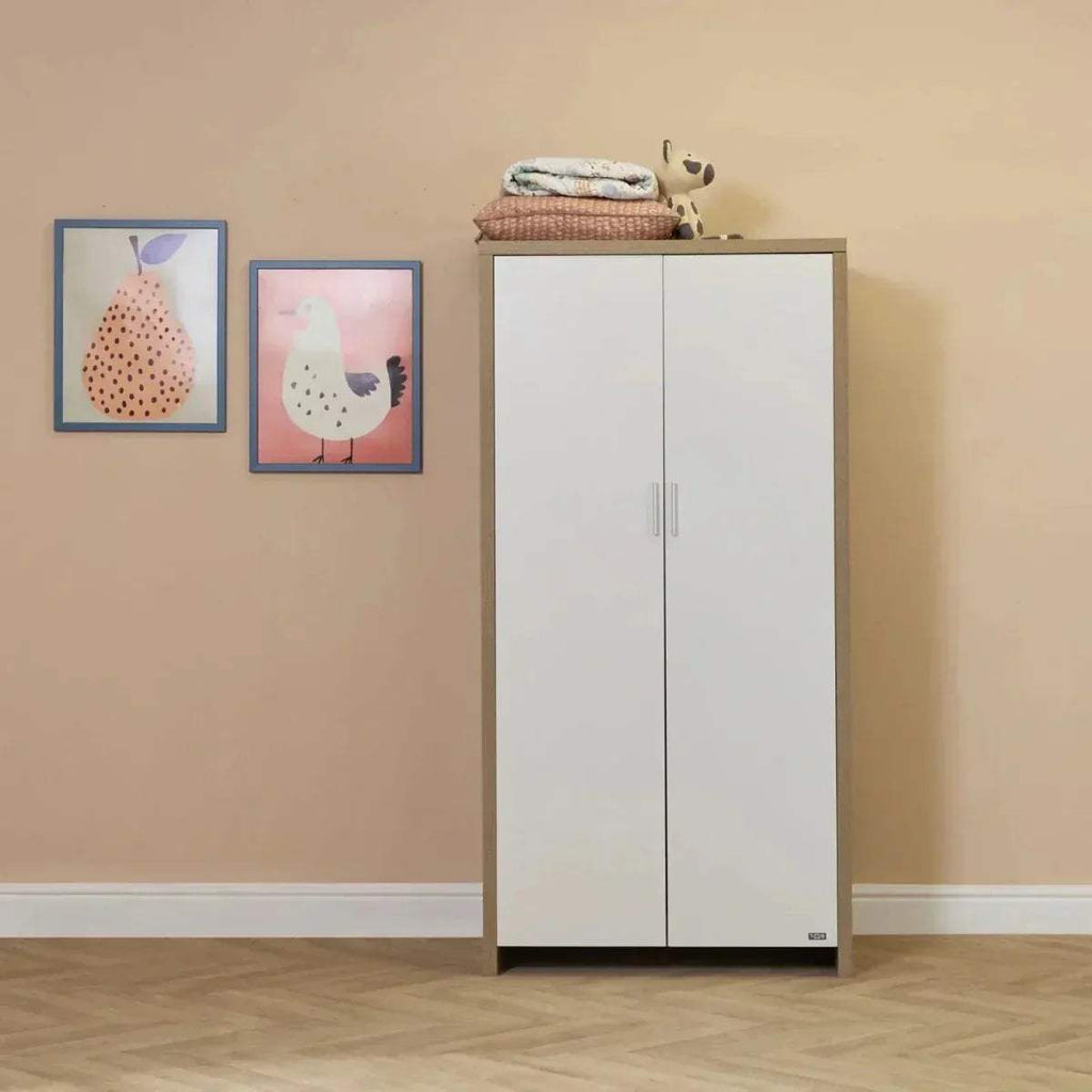 White wardrobe with light-oak top and vertical handles, part of baby room set.