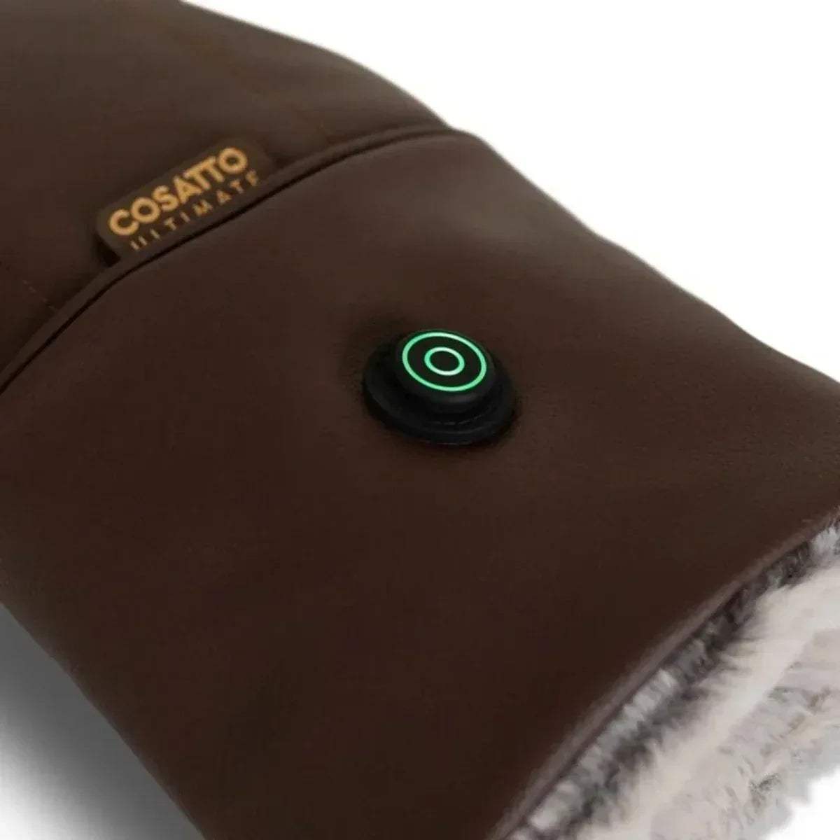 Brown heated snuggle mitt power button glowing green, plush fur trim visible