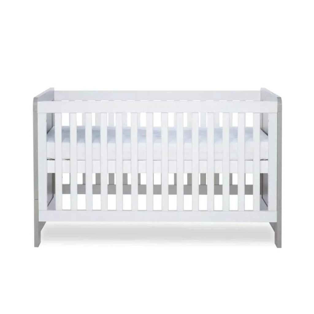 Cot bed front view with white slats and ash grey frame, viewed straight on.