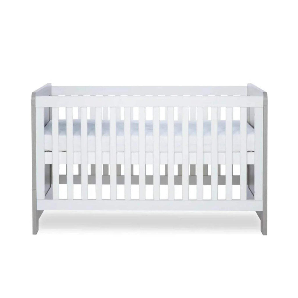 Cot bed interior with white slats and visible base panels