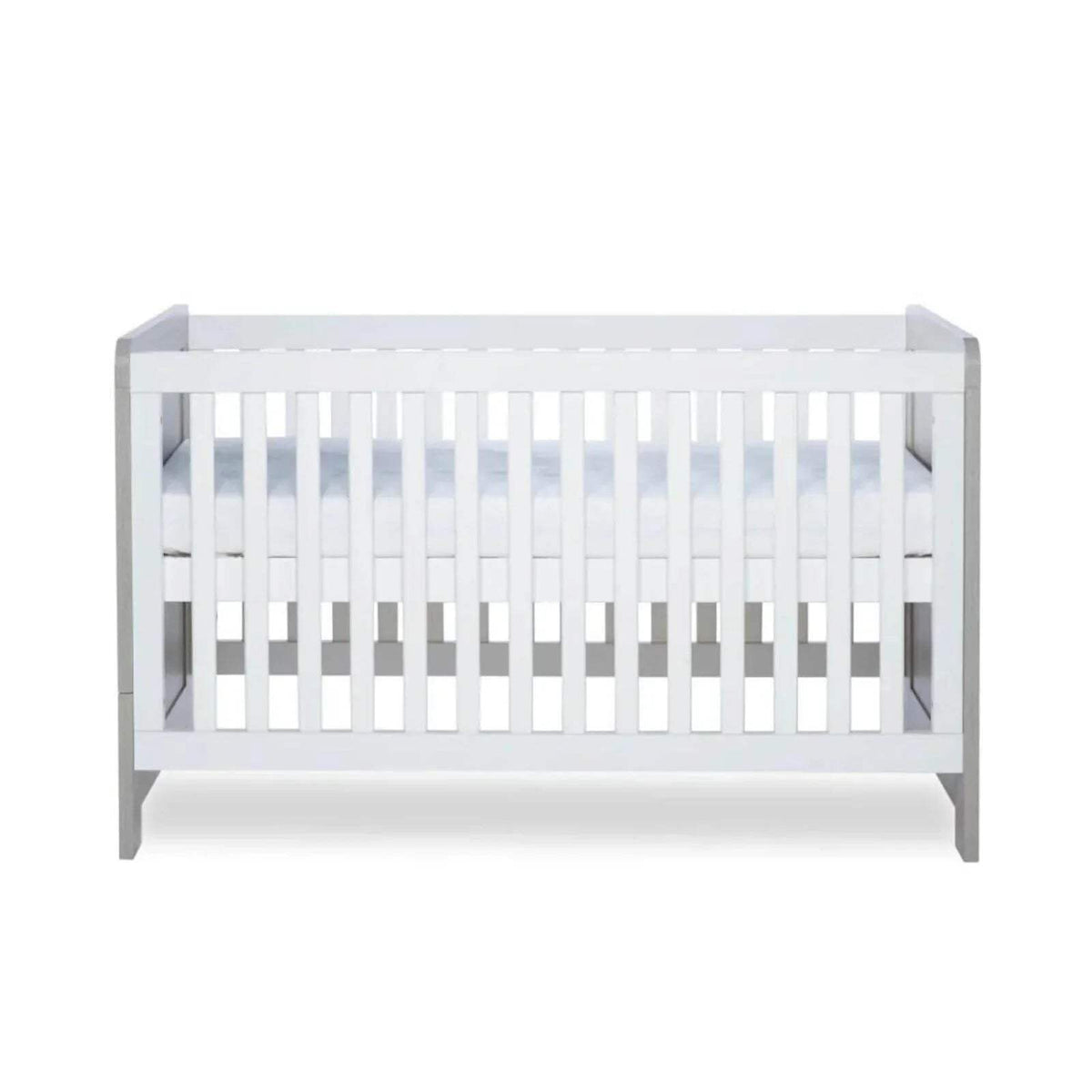 Cot bed interior with white slats and visible base panels