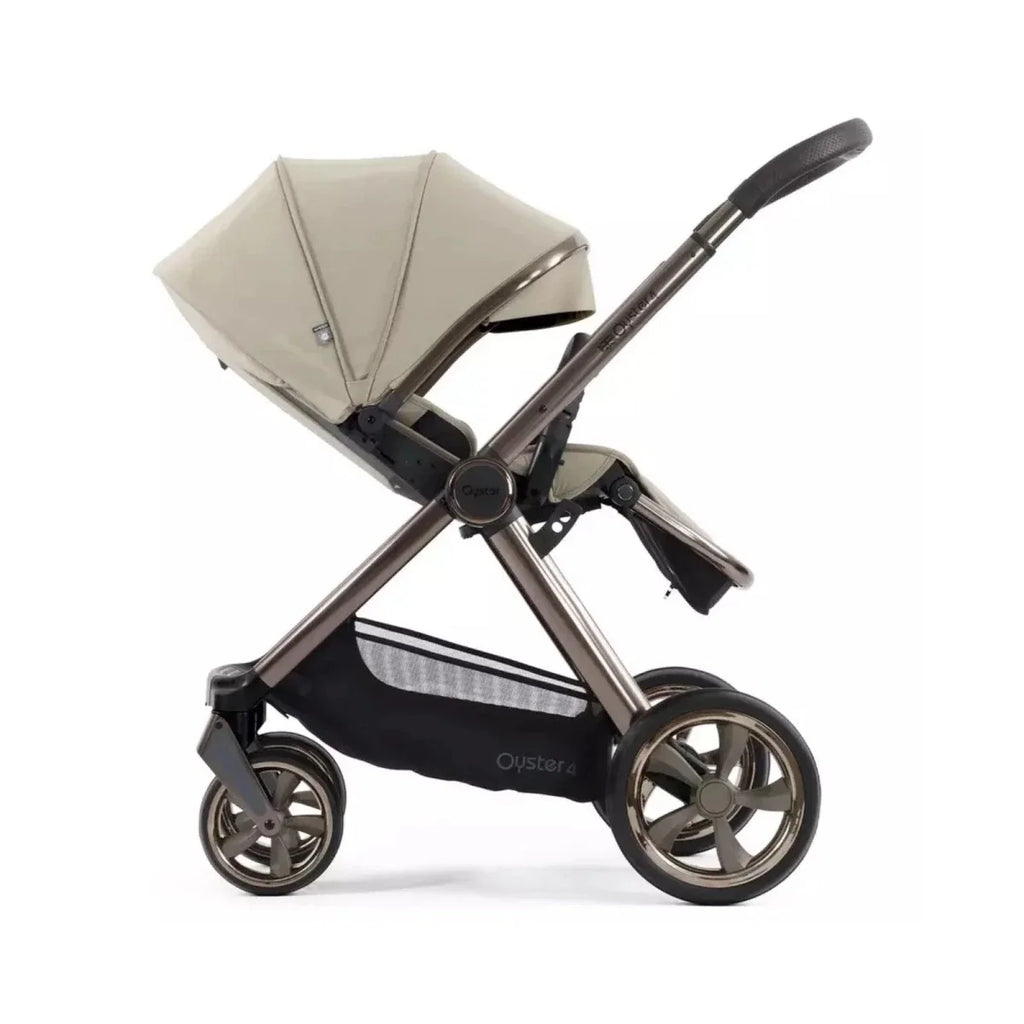 Single stroller with buttermilk canopy, black frame, and large front wheel, side view