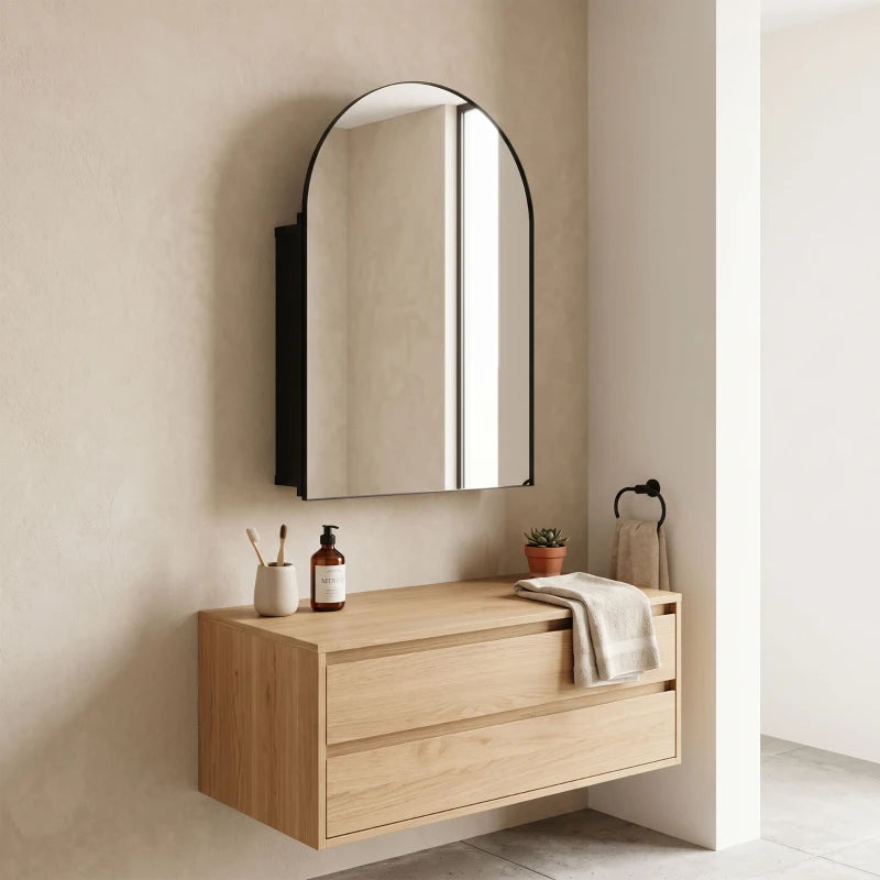 Arched black wall mirror cabinet with mirrored door mounted above a vanity