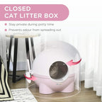 Pink enclosed cat litter box with front entrance, closed lid, and side scoop holder