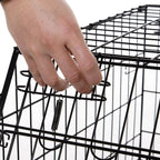 Close-up of secure latch on black wire dog crate door bar