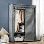 Light grey fabric wardrobe with open front, hanging rail, and stacked shelves for storage