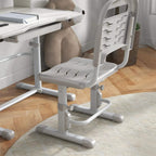 Grey height-adjustable kids chair next to adjustable study tabletop