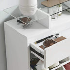 Pull-out drawer inside a white shoe storage cabinet with compartment space for shoes