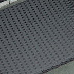 Black poly rattan seat weave close-up with fine grid texture