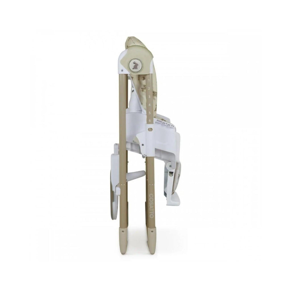 Baby highchair side view with foldable white legs and cream animal print seat.