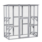 Light grey wooden cat outdoor enclosure with wire mesh walls and elevated interior platforms.