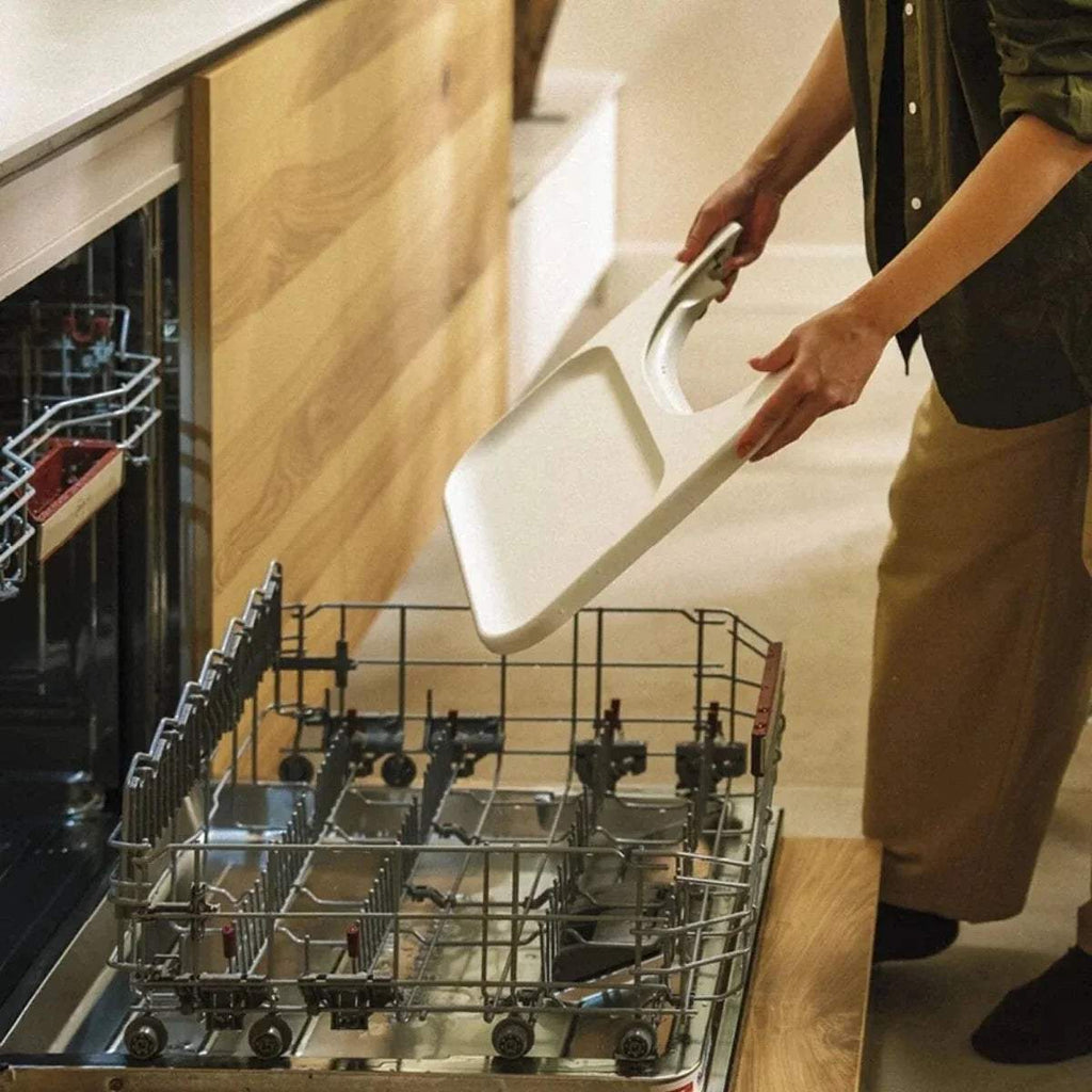 Stokke Steps highchair tray being placed in a dishwasher rack