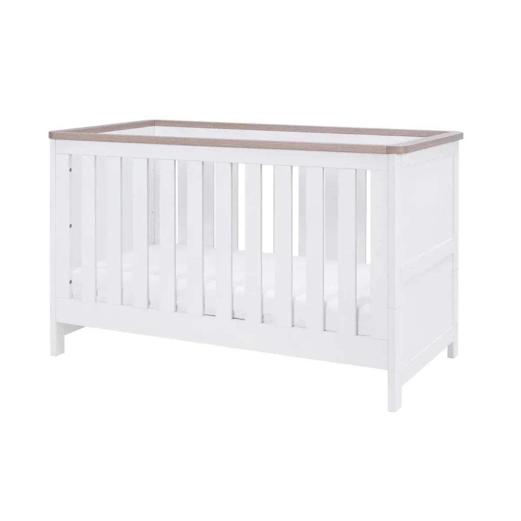 White cot bed mattress base with slatted front and oak trim top