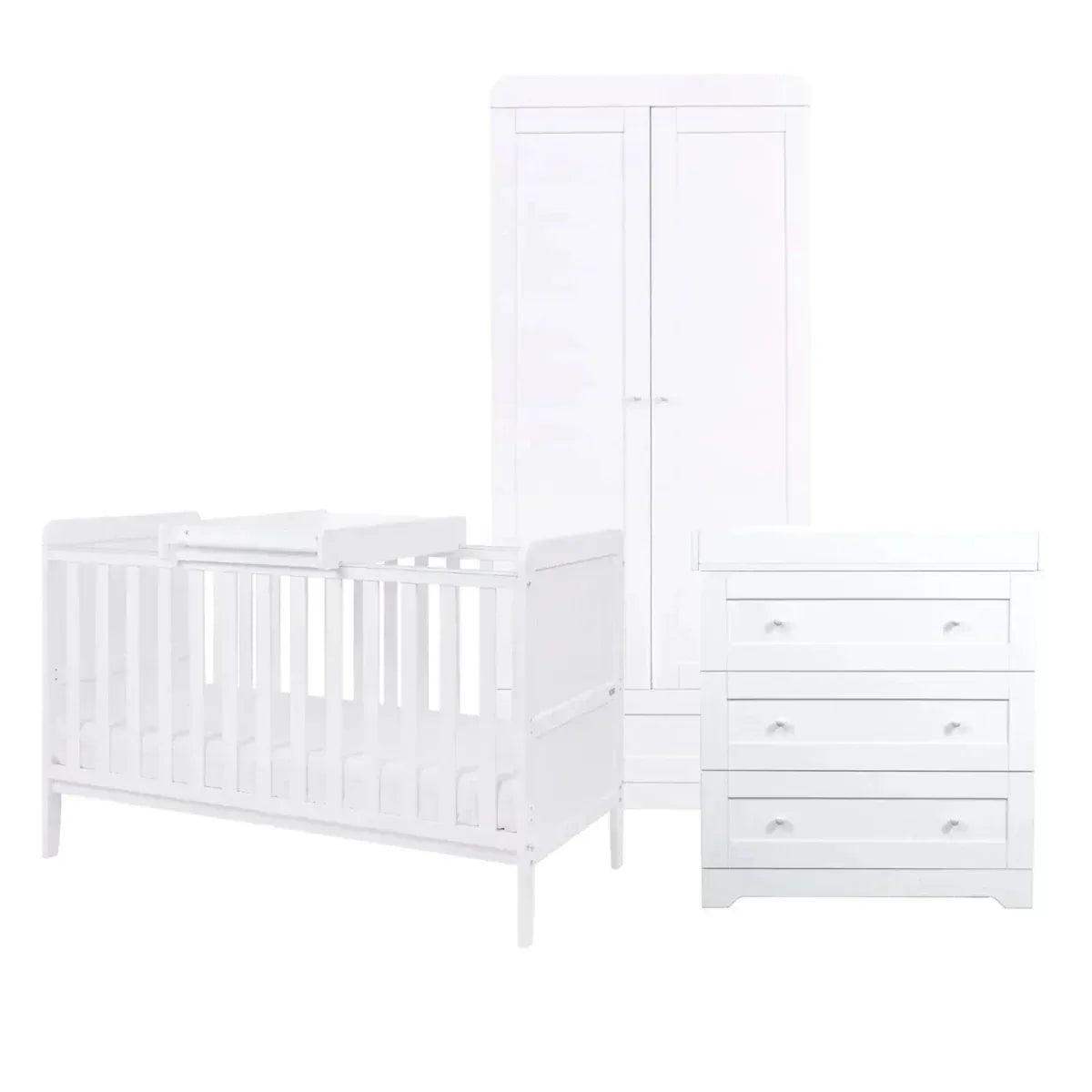 White nursery room set display: cot bed, wardrobe doors, and chest of drawers
