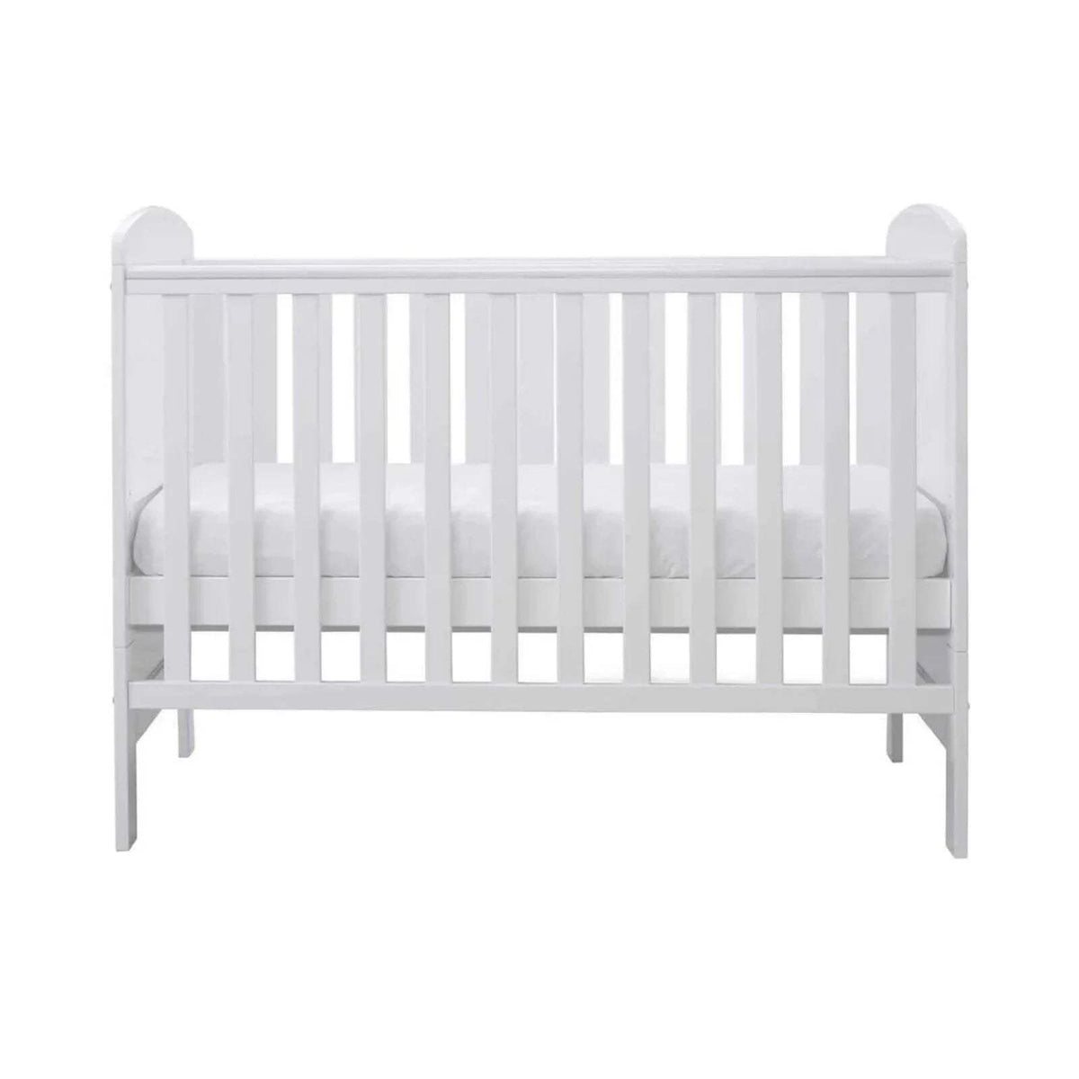 White mini cot bed side view with vertical slats and safety rail, without mattress