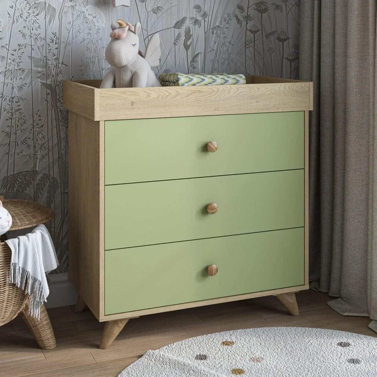 Pistachio green kids changing dresser with three drawers and wooden frame