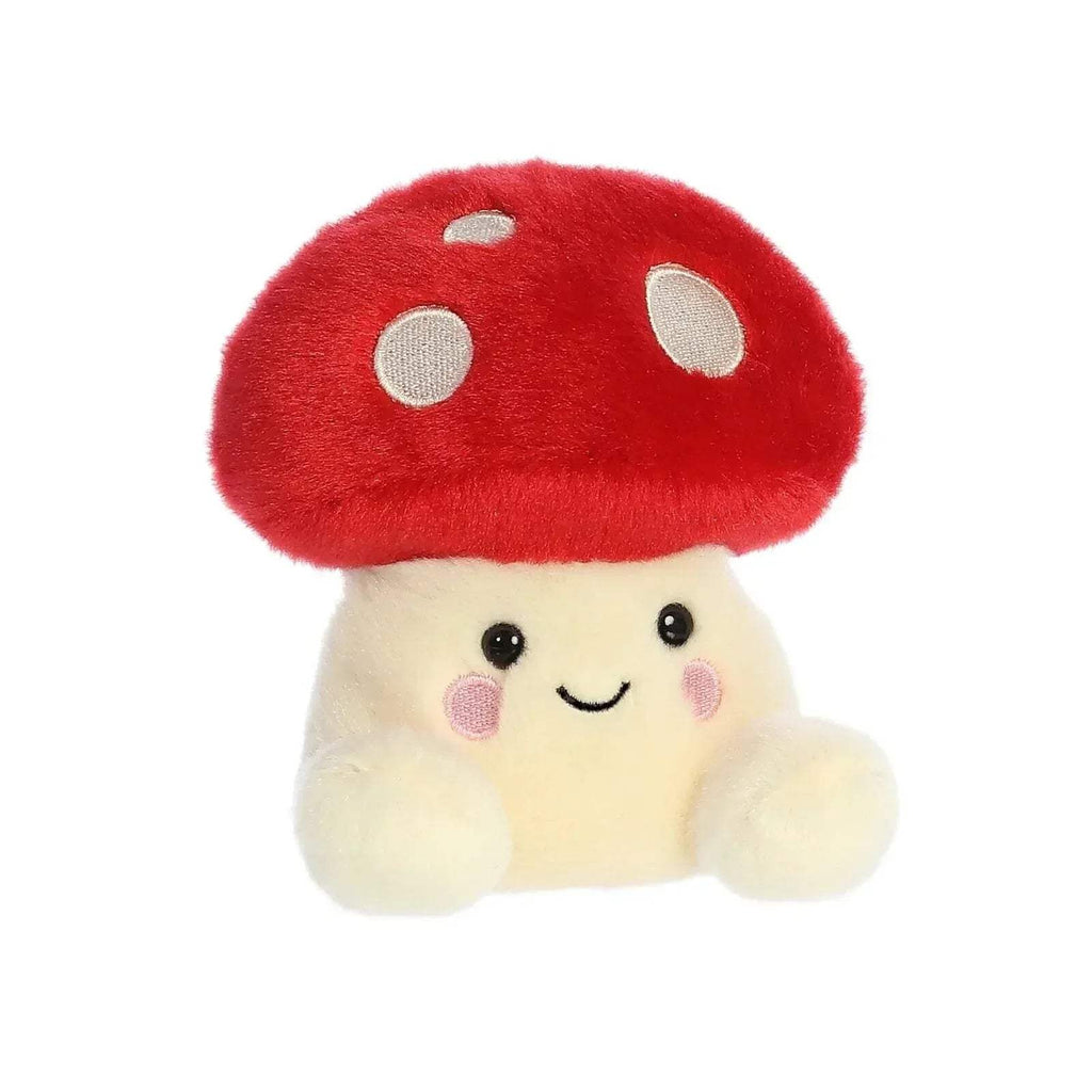 Red mushroom plush with cream body, smiling face, and pink blush on cheeks