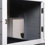 Grey wooden rabbit hutch door opening showing black tray and wire-mesh interior