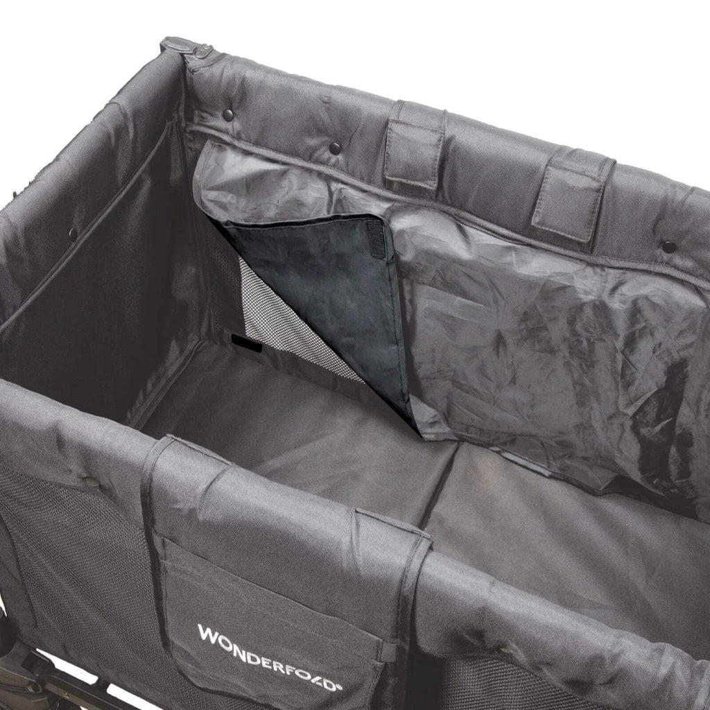 Black stroller wagon interior with seat, mesh panel, and zippered canopy section