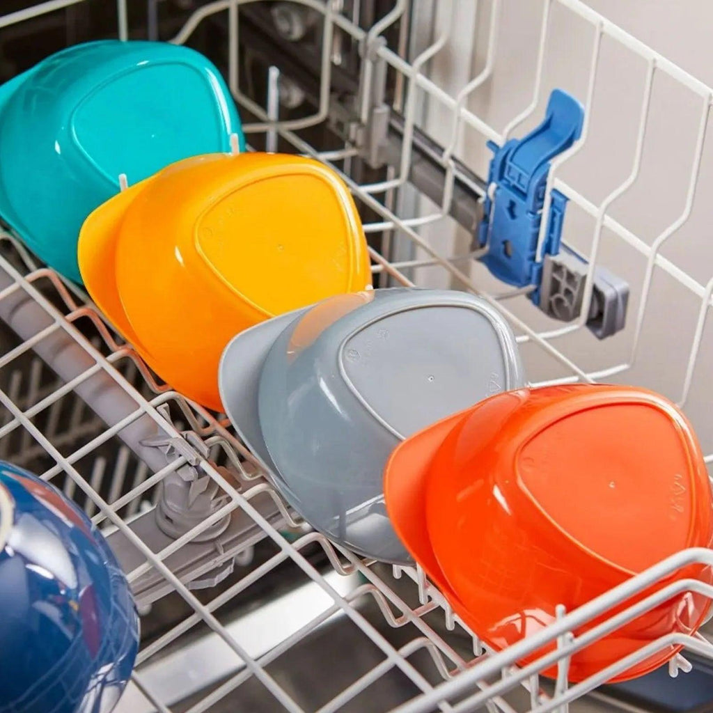Colorful Easi-Scoop feeding bowls in dishwasher rack: teal, yellow, gray, orange