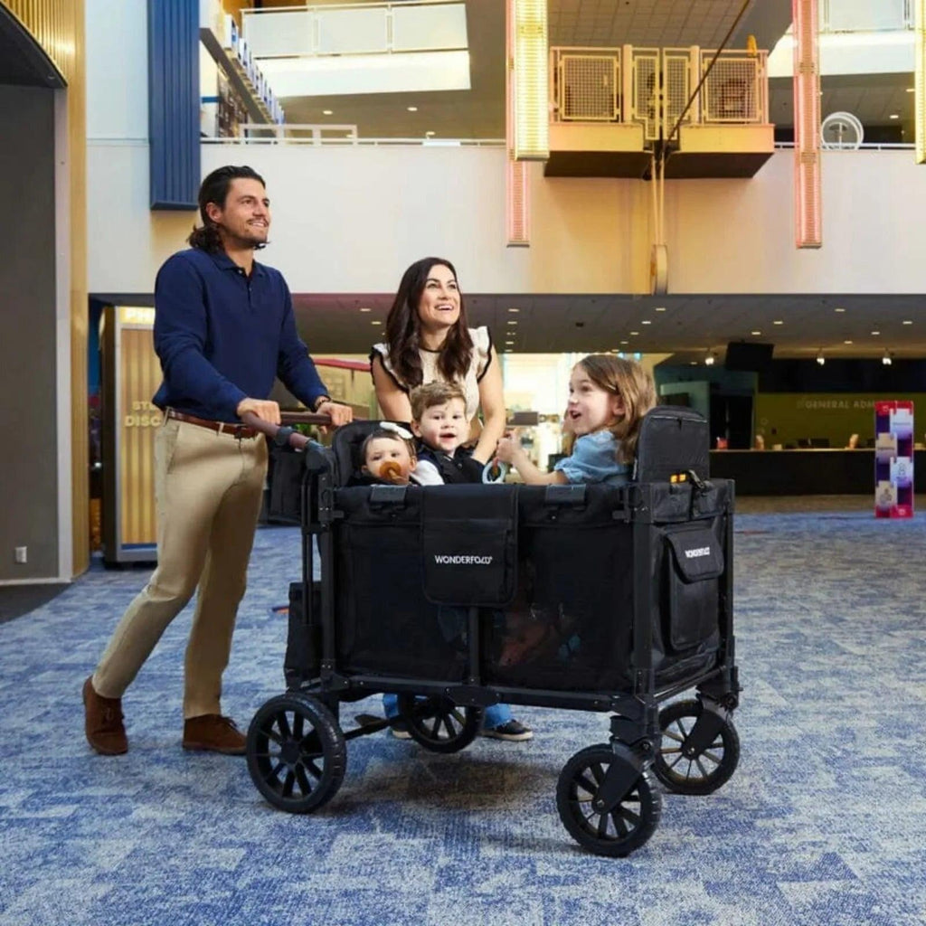 Jet black Wonderfold stroller wagon with multiple seats and front canopy
