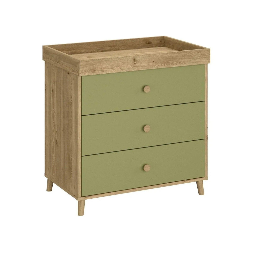 Pistachio green kids changing dresser with three drawers, wooden legs, and top tray