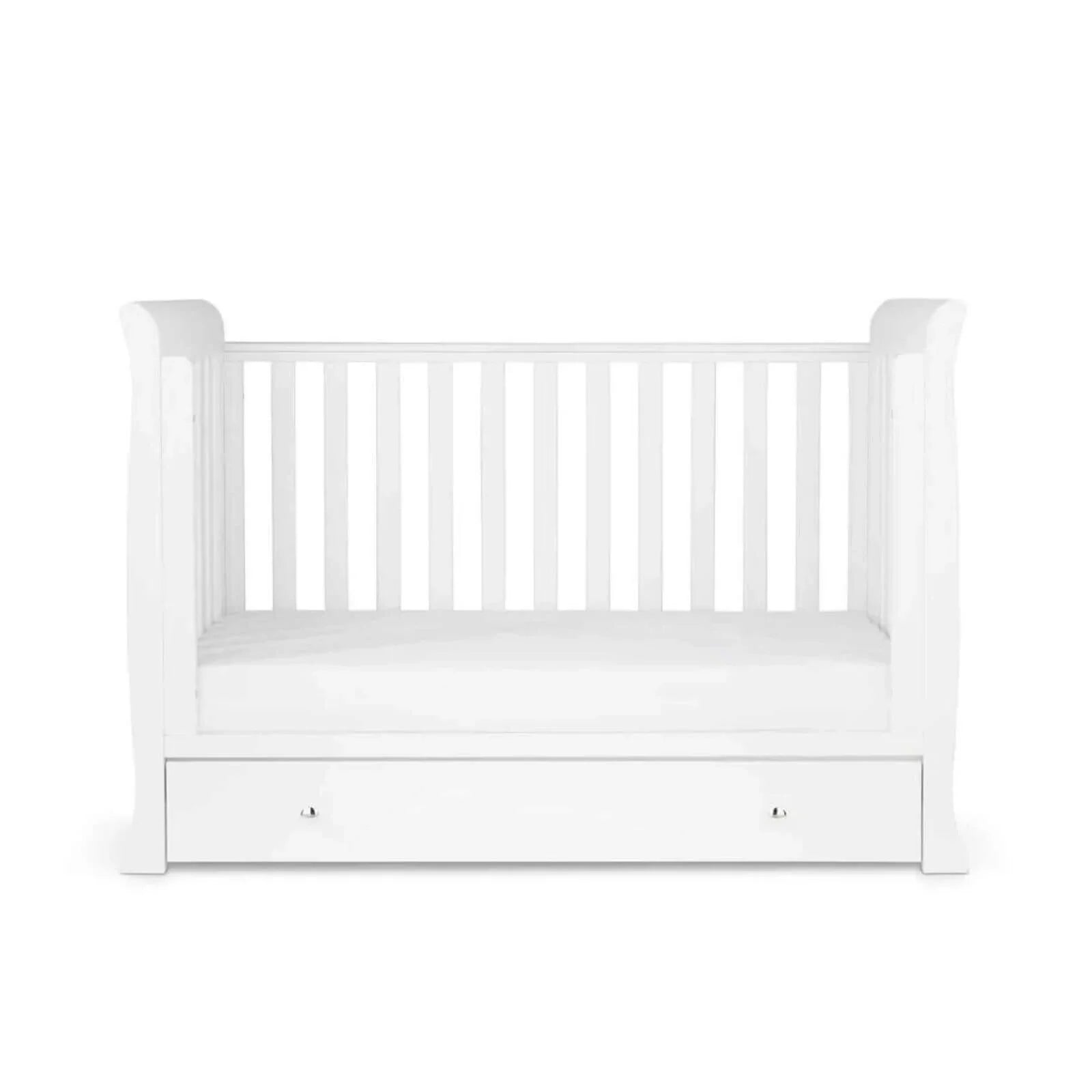 White mini cot bed with mattress in base position and front drawer panel