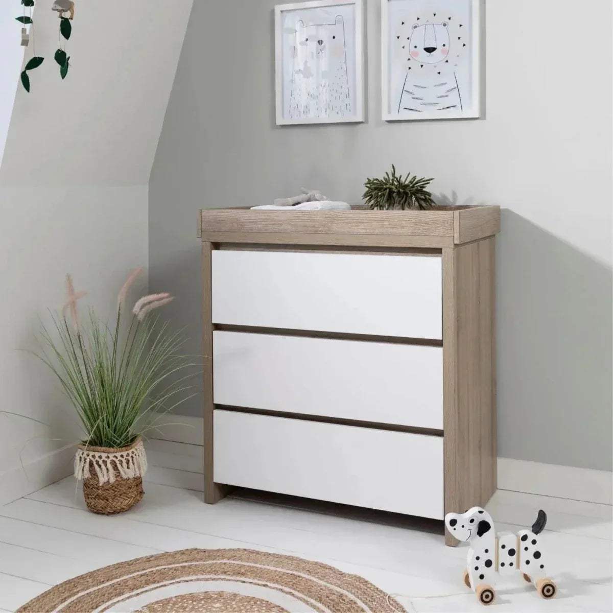 White and light oak changing unit with three panel shelves and top changing surface