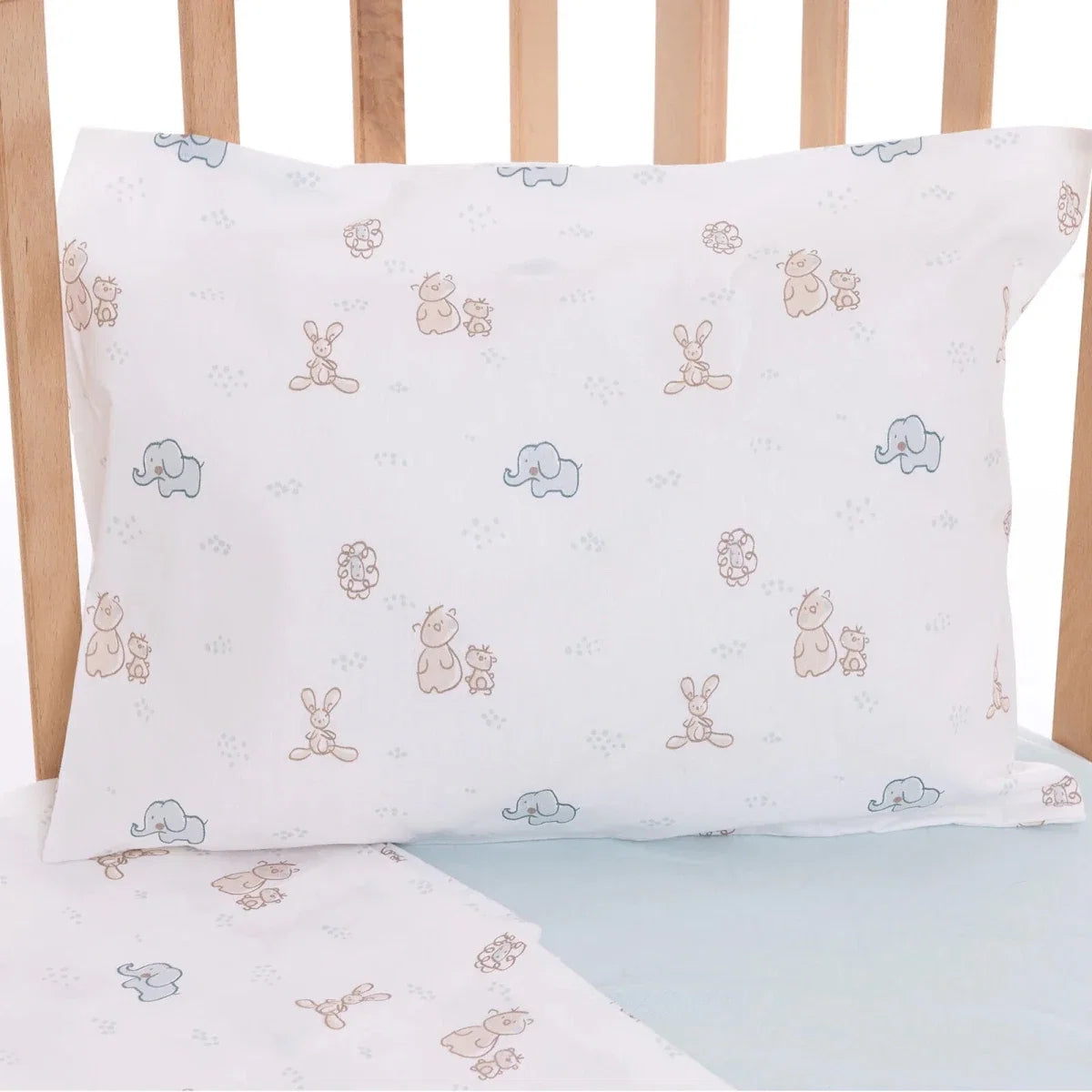 Animal printed pillowcase with light blue and beige motifs on white fabric