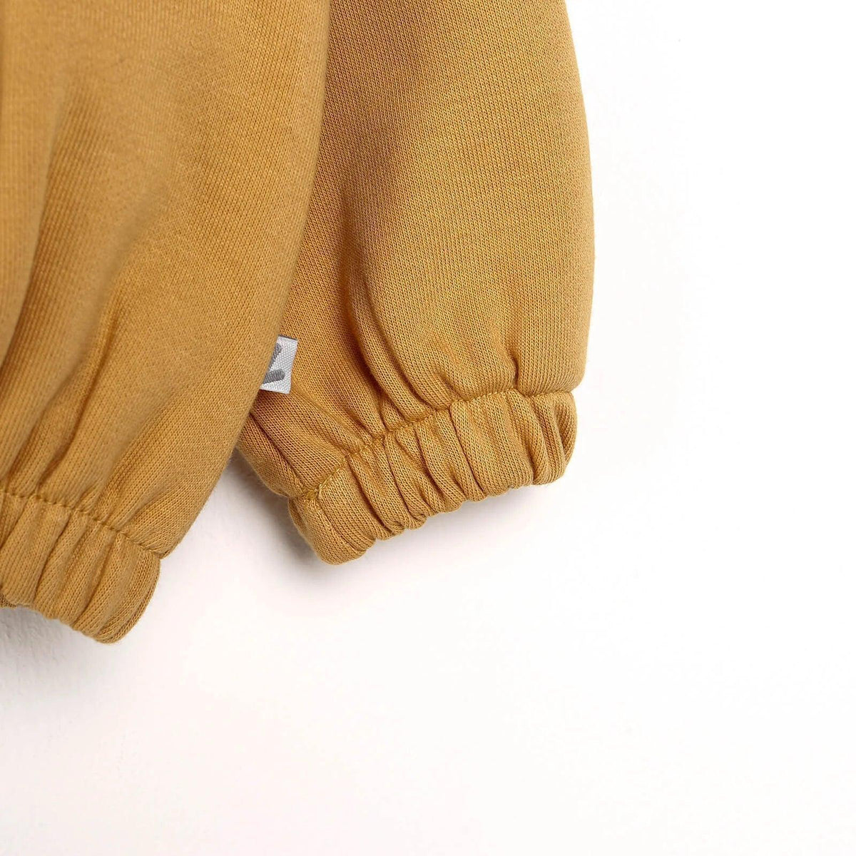 Baby cardigan cuffs and hem with elastic gathers in cinnamon brown
