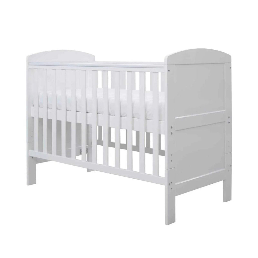 White mini cot bed frame, side view with vertical safety bars and panel detail