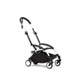 White stroller frame with black seat and compact four-wheel base