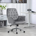 Dark grey upholstered swivel office chair with armrests, tufted back, and rolling casters