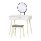 White makeup vanity table with round mirror and gray upholstered stool