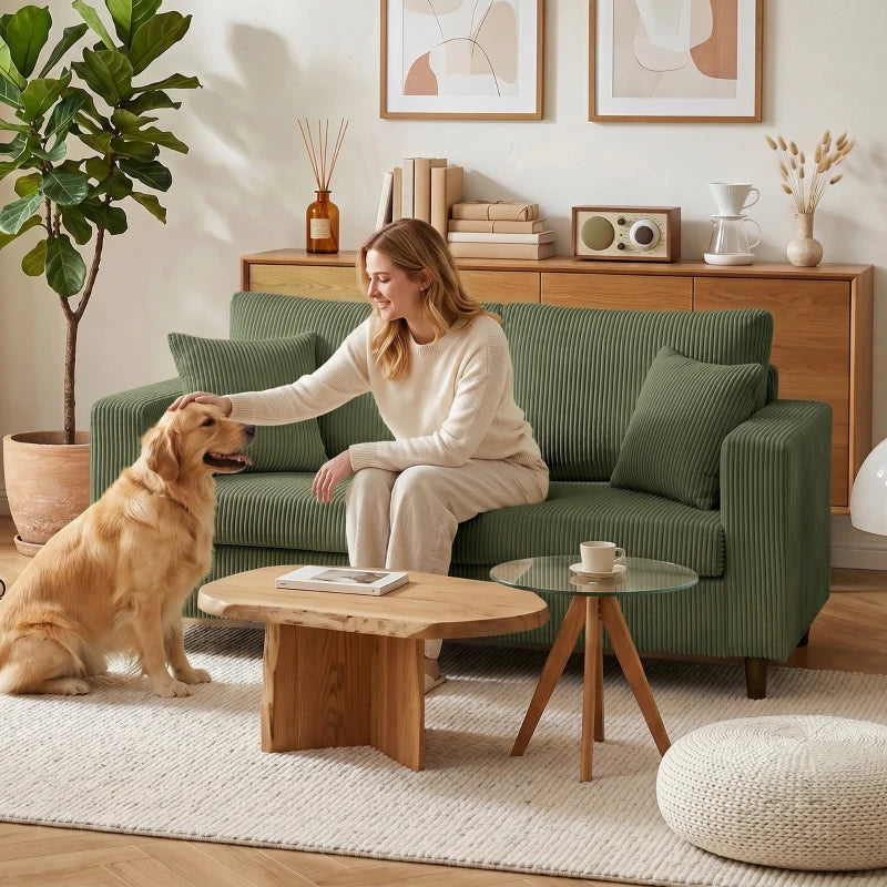 Green corduroy loveseat sofa with wide arms and plush seat cushion
