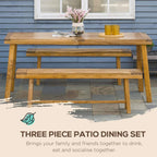 Acacia wood patio dining table with two benches and centerpiece arrangement
