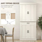White tall cabinet with two doors and center drawer; anti-tip strap visible