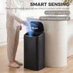 Black sensor trash bin with open lid and hand-free lid lift shown in use.