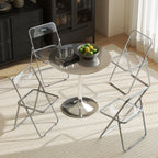 Clear folding chairs with transparent seats and backs around a small round table