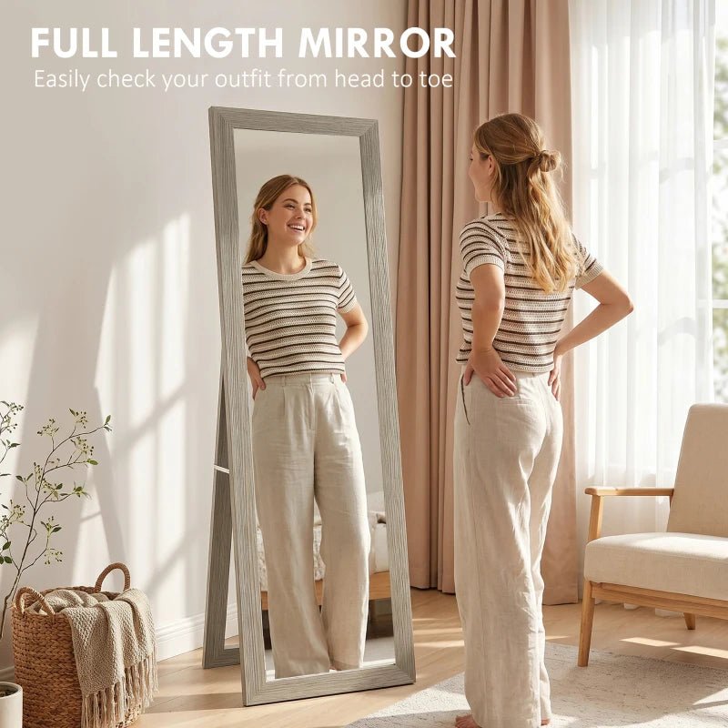 Full-length grey mirror with rectangular glass, person checking outfit