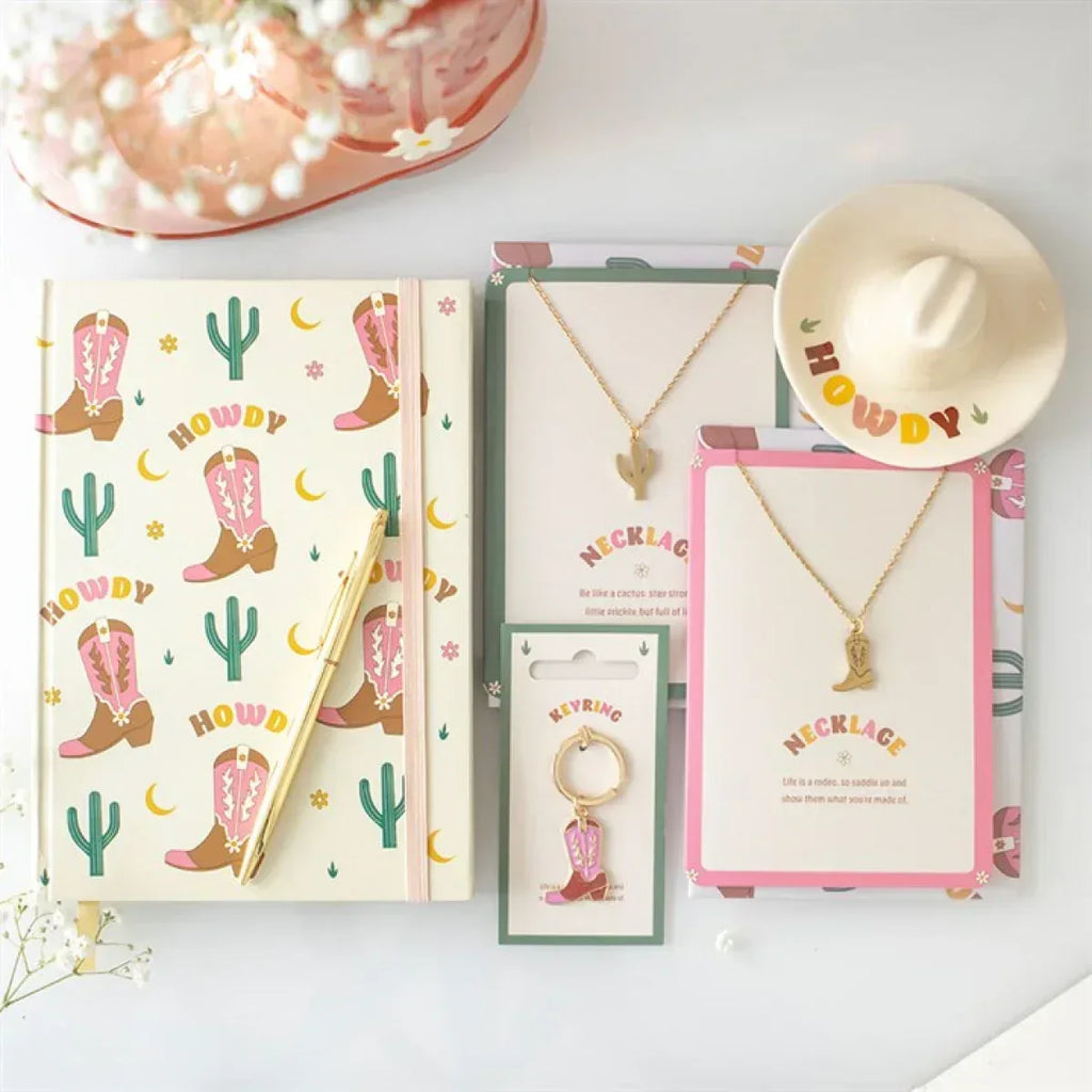 Cowboy boot keyring on a card with gold-tone ring and pink boot charm