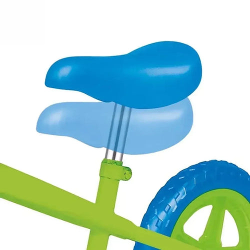 Blue padded seat on green balance bike frame with front wheel and handlebar grips