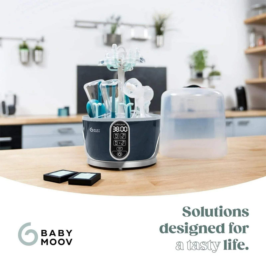 Babymoov Turbo Pure steriliser and dryer with bottles on rack; front display panel visible