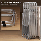 Stacked clear folding chairs with transparent backrests, steel frames
