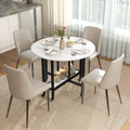 Round white marble folding dining table with open shelf and black legs, set for meals